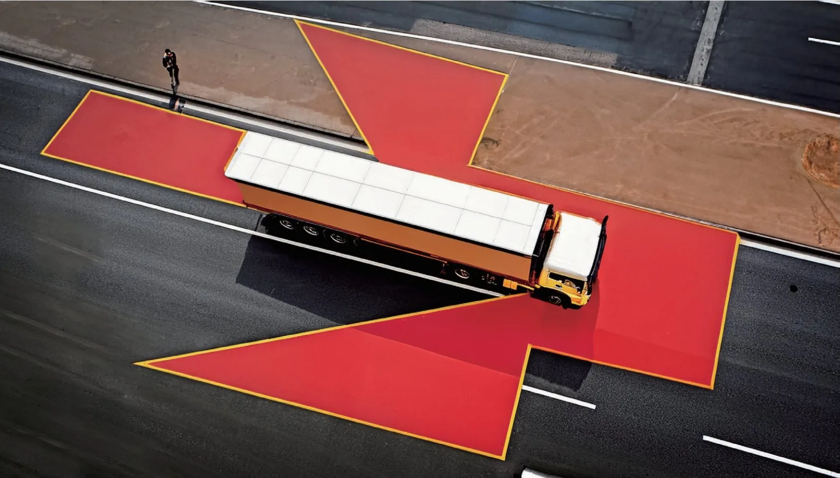 Truck from above with its blind-spot zones marked in red
